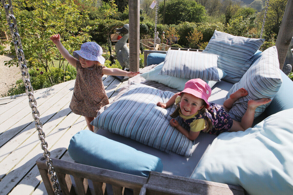 children-playing-on-swinging-day-bed.jpg