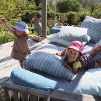 children-playing-on-swinging-day-bed.jpg