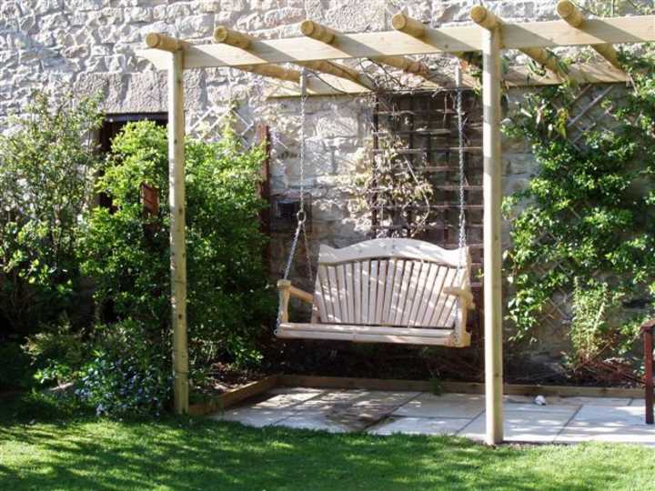 Pergola with outlet swing seat