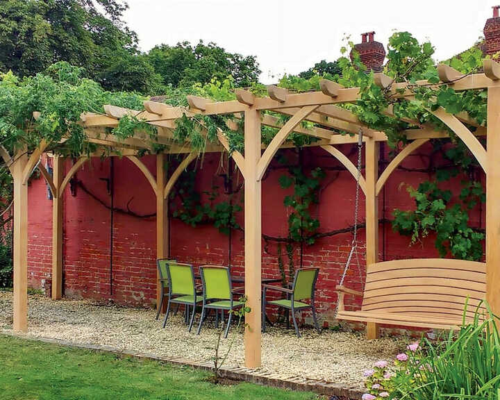 Handmade bespoke pergola with swing seat and table