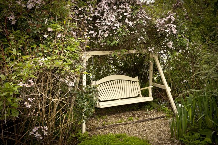 Harmony Swing Seat Surrounded by Clematis