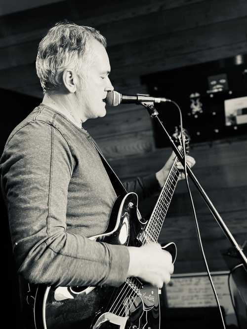 Matthew Wilson playing guitar