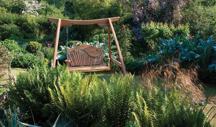 The Swirl-Back Kyokusen Garden Swing Seat in Curved Oak