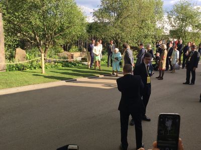 The Queen strolls by our stand!