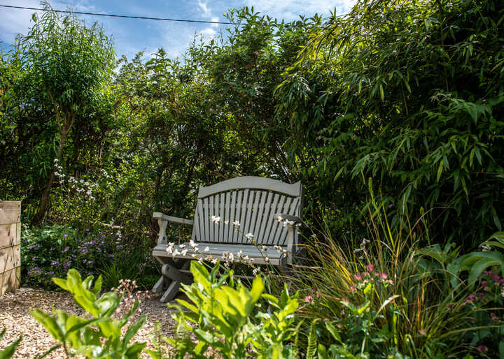 Add Relaxing Movement To Small Outdoor Spaces With A Garden Rocking Bench