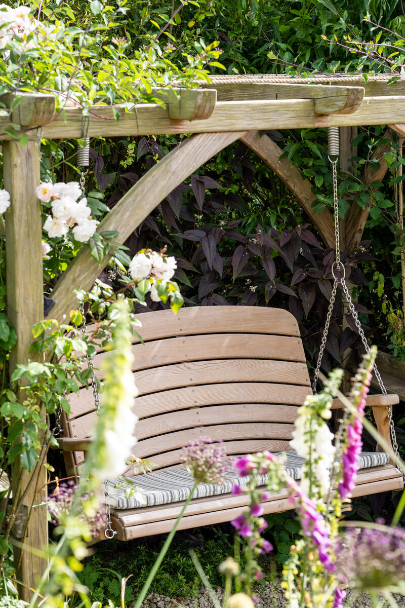 Swing Seat Hanging from Oak Pergola