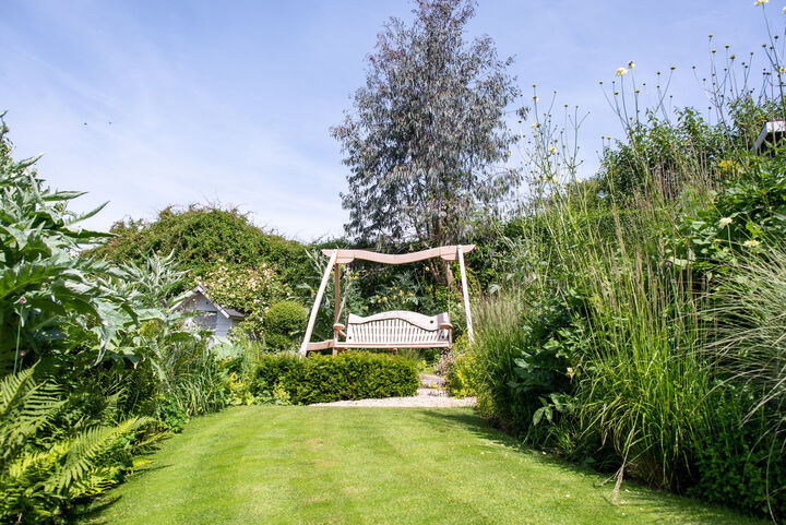 Curved Oak Swing Seat in Garden