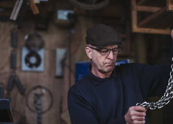 Bob Andrews of Sitting Spiritually measuring chains for the swing seat