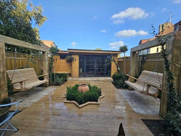 arch pergola in small garden